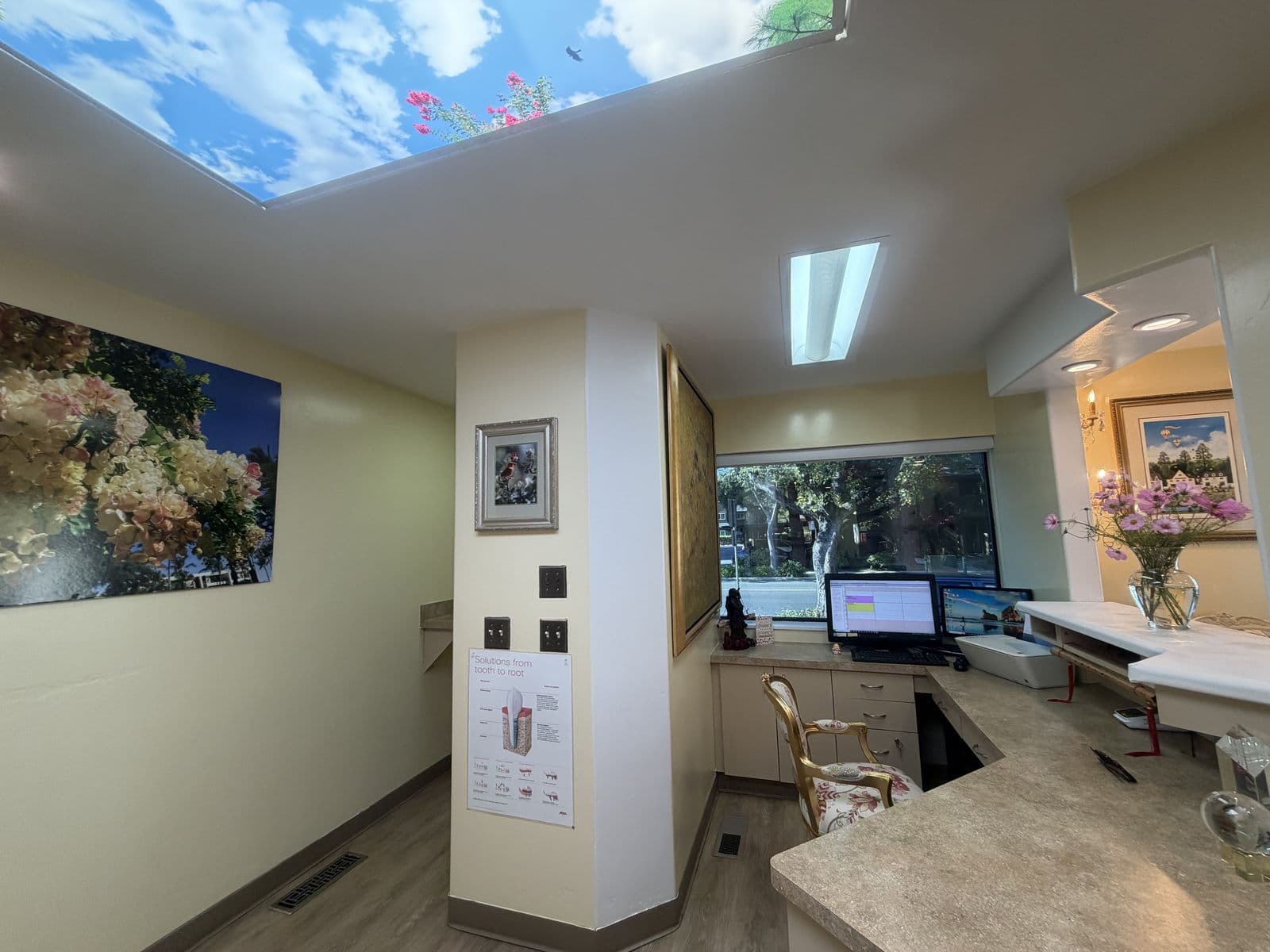 Front desk under a sky-panel ceiling light