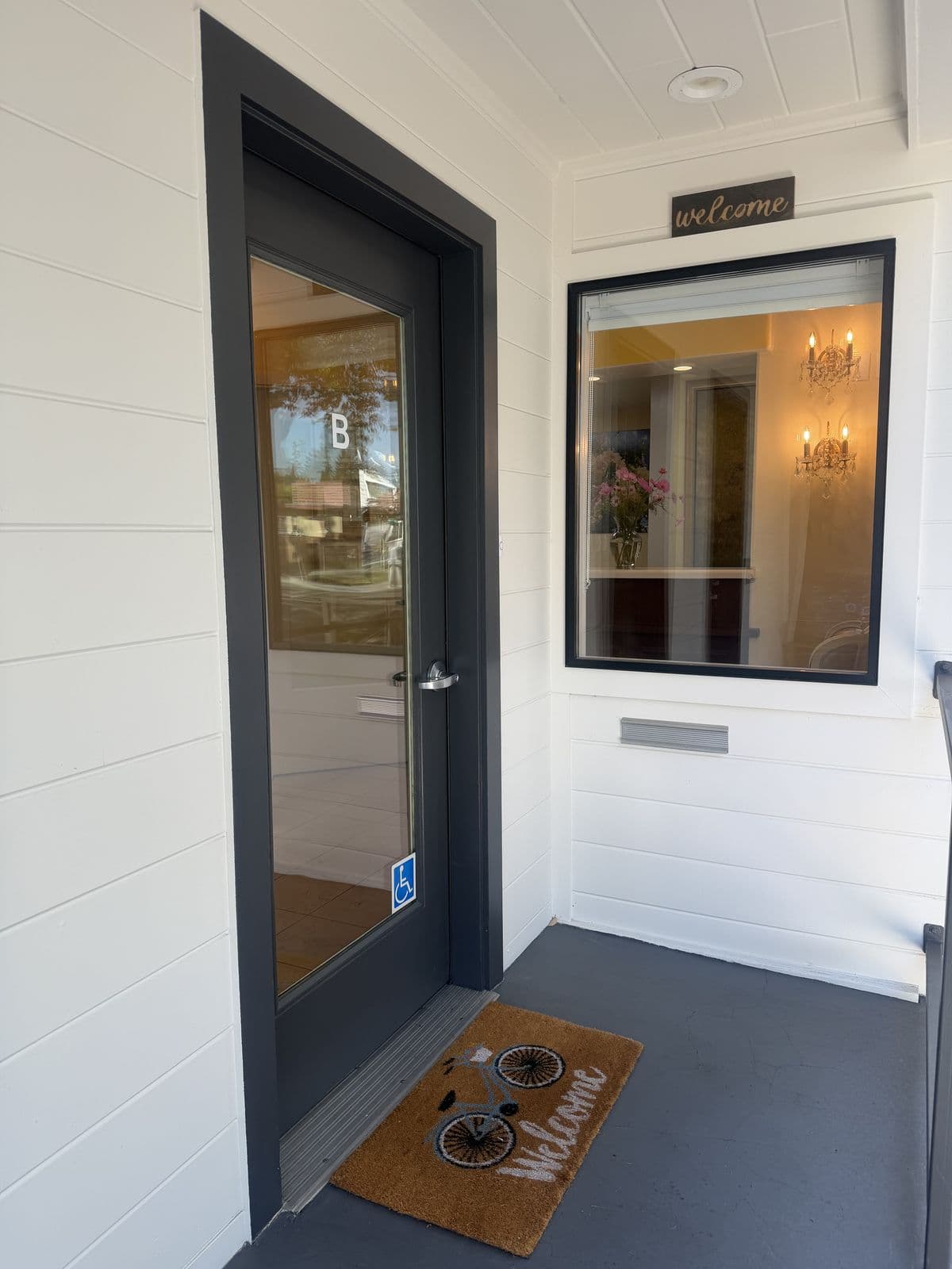 Entrance to Suite B with a welcome sign