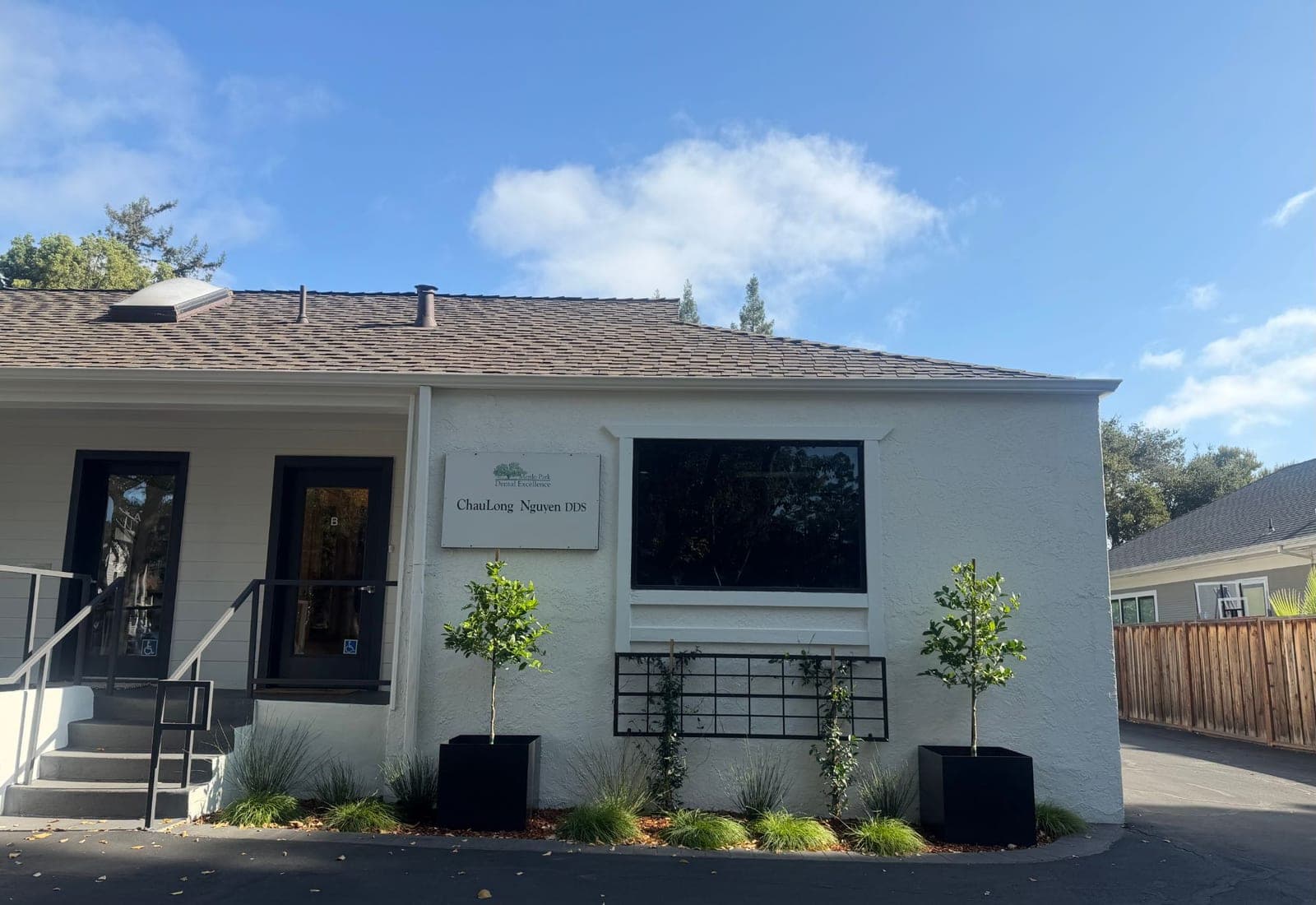 Front of the office with the Menlo Park Dental Excellence — ChauLong Nguyen DDS sign beside the Suite B door
